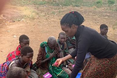 Rachel attending to the youths and elderly in Karamoja.