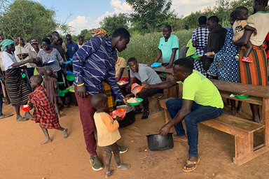 Community members in Karamoja receiving food.