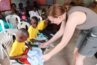 Kids at Golden Care School receiving gifts from the TUPS team.
