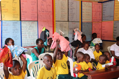 Children at Golden Care School with their gifts from the TUPS team.