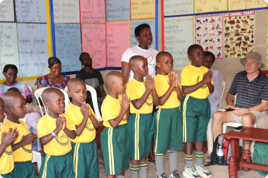 Kids at Golden Care School presenting to the TUPS team during a visit.