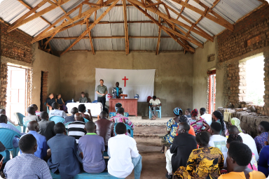 James sharing the Gospel to Pastors and ministers in Kasese district.