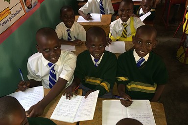 A moment of collaborative learning and bright smiles at a TUPs-supported school.