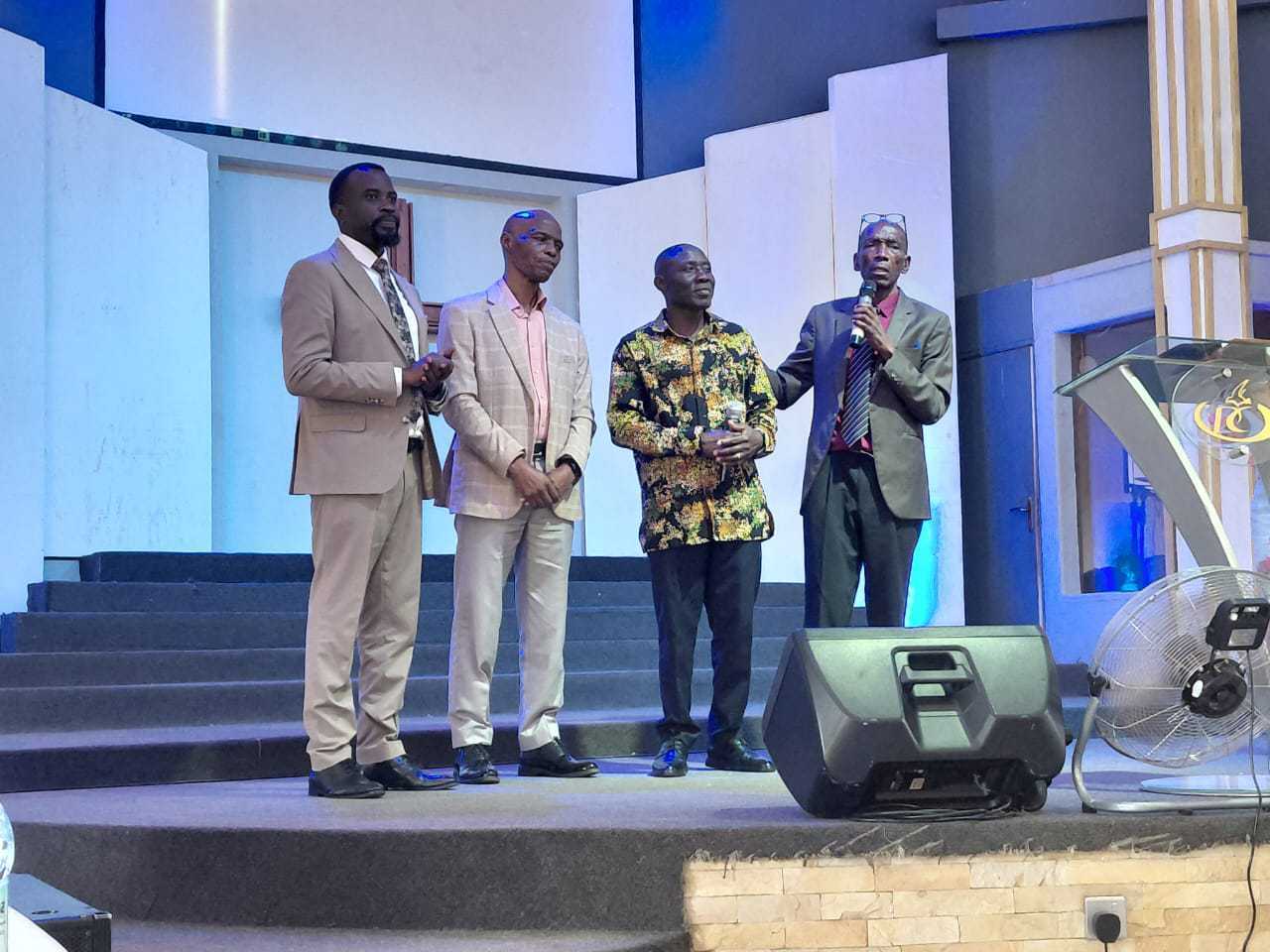 Junior ministering at his home church in Mbarara district.